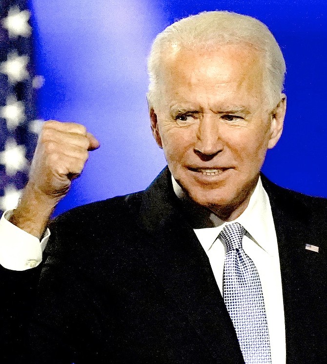 PRESIDENT-elect Joe Biden gestures to supporters on Saturday in Wilmington, Del. Photo: Andrew Harnik/AP