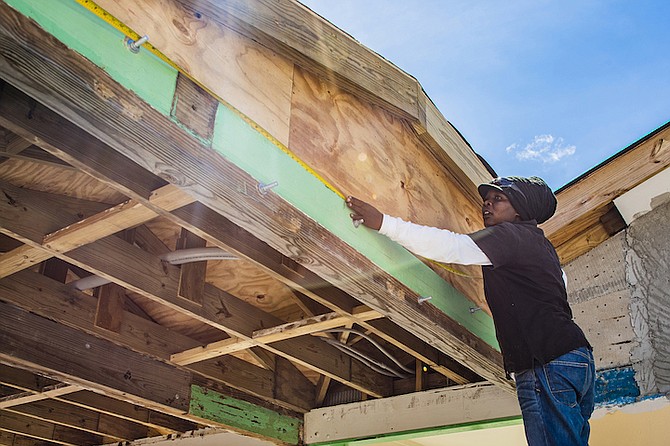 SITHA SILIEN, 28, a proud resident of Abaco, shows off the skills she learned as part of the GER3 Team while working on the Central Abaco Primary School restoration project. Photo: Zyndrac Jones