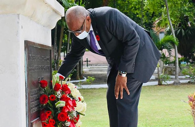 PRIME Minister Dr Hubert Minnis leaving a wreath of remembrance at the cenotaph in Rawson Square. Photos: Terrel W Carey Sr/Tribune staff