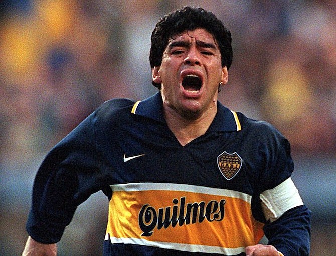Diego Armando Maradona celebrates a goal on his last official soccer game with Boca Juniors in Buenos Aires, Argentina.The Argentine soccer great who was among the best players ever and who led his country to the 1986 World Cup title before later struggling with cocaine use and obesity, died from a heart attack on Wednesday, Nov. 25, 2020, at his home in Buenos Aires. He was 60. (AP Photo/Eduardo Di Baia, File)