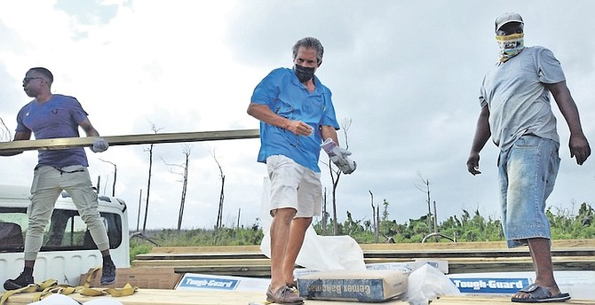 MEMBERS of the Rotary Grand Bahama Disaster Relief Committee in partnership with the Grand Bahama Power company have been helping Rocky Creek residents.