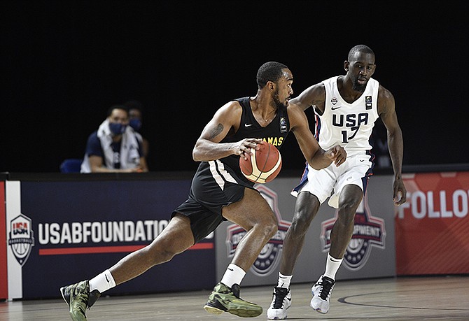 DSHON TAYLOR, left, competes for Team Bahamas in the FIBA AmeriCup 2022 Qualifiers as they lost to the USA on match day 3 of the latest window at Indiana Convention Center in Indianapolis, Indiana. Photos by Marc Lebryk