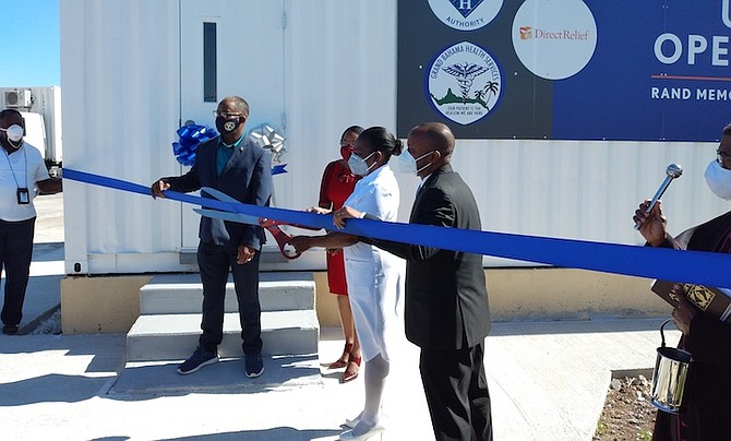 FROM left, Minister of State Iram Lewis and Minister of State for Grand Bahama Kwasi Thompson attend the ribbon cutting for a new container operating theatre at Rand Memorial Hospital. Photo: Denise Maycock