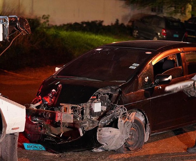 The damaged car at the scene on Soldier Road. Photos: Terrel W Carey Sr/Tribune staff