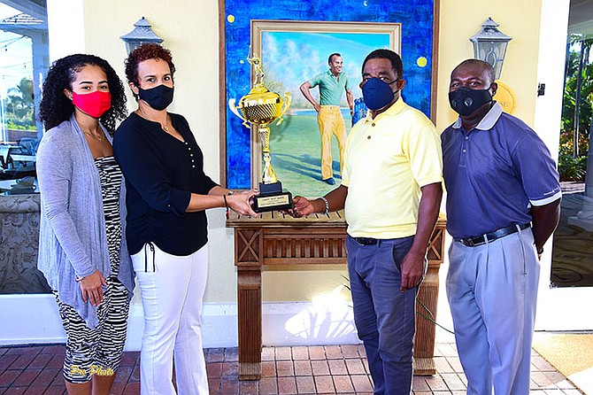 SASHA and Christine Wallace-Whitfield present the championship trophy to veteran golfer Greg Maycock. Chris Lewis, president of the Bahamas Professional Golfers Association, at far right, looks on.
Photos courtesy of David Knowles