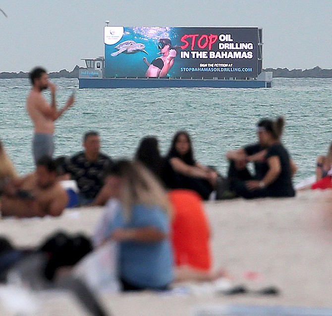 OIL activists took their protests over drilling in The Bahamas to Miami - with a billboard on a barge off the shore of Miami Beach. The move comes amid new claims that The Bahamas could be held liable in US courts for any oil spillage in Bahamian waters. 
Photo: Logan Fazio