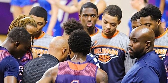 COACH GREENE, far right, in the huddle.