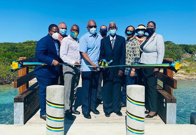 Prime Minister Dr Hubert Minnis (centre left) cuts the ribbon to signal the Official Opening of Newton Cay Bridge, Long Island, on Friday. (BIS Photos/Yontalay Bowe)