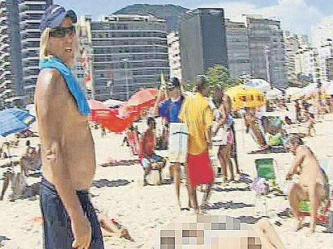 PETER Nygard in this image from video in which he was seen walking on a Brazilian beach looking at women and saying to an interpreter to tell a young girl to “lie about her age”. Photo: Mega Agency