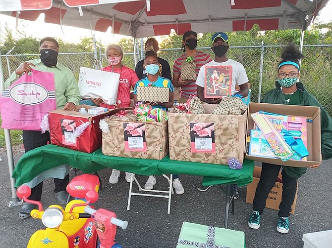 SYDNEY CLARKE, flanked by her friends, display some of the items that she collected for distribution to the Bahamas Children’s Emergency Hostel.