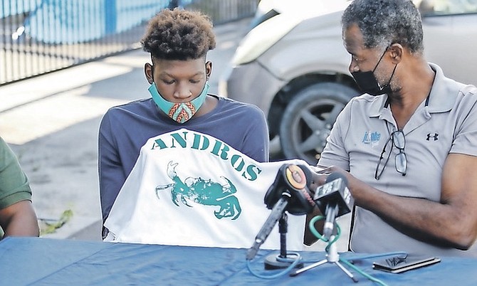 PETER Gilcud presents Fredrick King Jr with his Andros shirt.