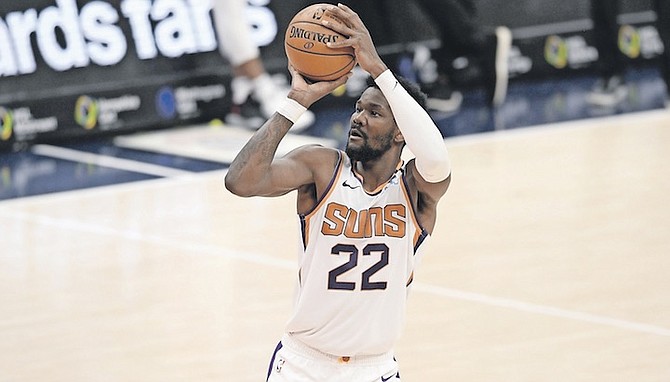PHOENIX Suns centre Deandre Ayton (22) shoots during the first half against the Washington Wizards on Monday in Washington. Ayton and the Suns have had their third consecutive game postponed in accordance with the NBA’s health and safety protocols put in place as a result of the COVID-19 pandemic.
(AP Photo/Nick Wass)