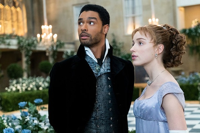 REGÉ-Jean Page as the Duke of Hastings and Phoebe Dynevor as Daphne Bridgerton.