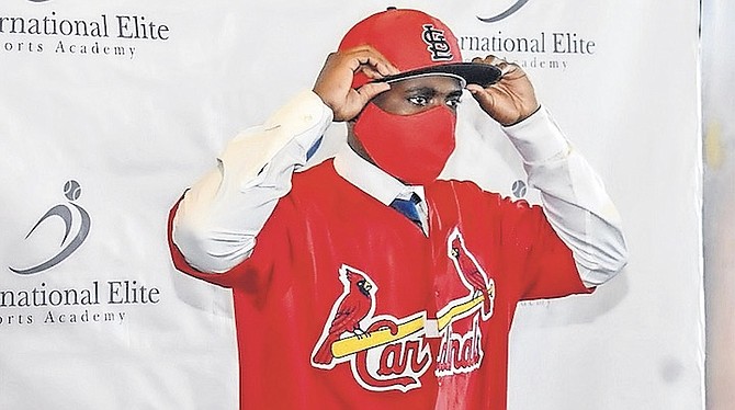 ADARI GRANT, of the Bahamas, officially became the newest member of the St Louis Cardinals organisation. He signed his contract to join the club among family and well wishers at the Pelican Bay Resort in Grand Bahama yesterday.
Photos courtesy of 10th Year Seniors