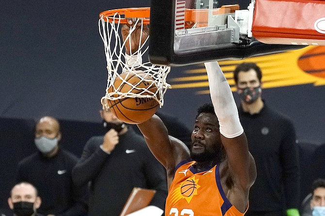 PHOENIX Suns centre Deandre Ayton (22) dunks during the second half against the Denver Nuggets on Friday in Phoenix. The Nuggets won 130-126.
(AP Photo/Rick Scuteri)