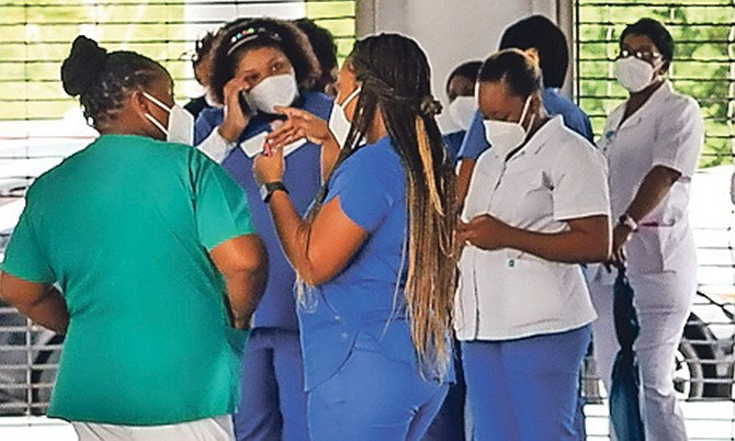 Some of the nurses gathered at the Ministry of Health yesterday seeking answers over their overtime pay concerns.
Photo: Donovan McIntosh/Tribune staff