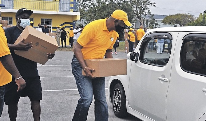 BOXES of food being given out by the PLP in Freeport on Saturday. Photo: Vandyke Hepburn