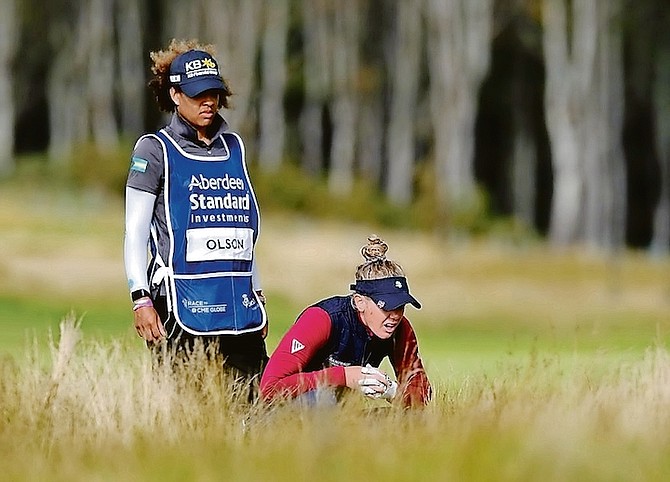 TANEKA SANDIFORD-MACKEY, of the Bahamas, is the first Bahamian and only black female full-time caddie on the Ladies Professional Golf Association (LPGA) Tour. For the past four years, the former 
basketball player at St John’s College has been carrying the golf bag and helping to make some key decisions for American Amy Olson (pictured above).