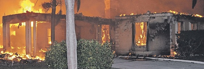 THE HOME of Sir Albert Miller ablaze on Friday evening. Photo: Vandyke Hepburn