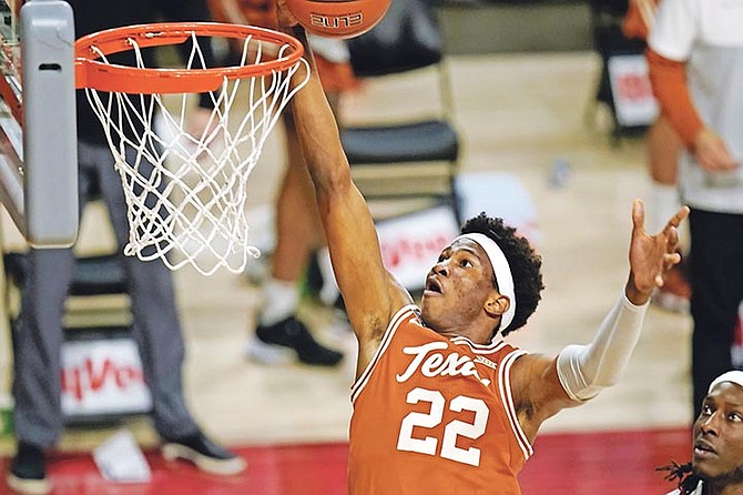 Texas forward Kai Jones drives to the basket against Iowa State on Tuesday night in Ames, Iowa. Texas won 81-67.
(AP Photo/Charlie Neibergall)