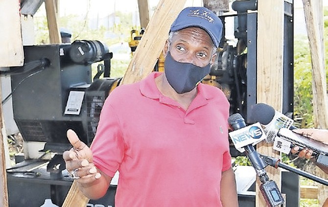 MINISTER of Works Desmond Bannister in The Farm shanty town in Abaco in February.