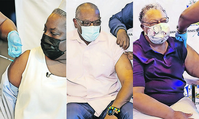 THE FIRST vaccinations against COVID-19 were delivered yesterday. The first patient to receive the vaccine was public health nurse Ruth Bastian, pictured left, followed closely by Prime Minister
Dr Hubert Minnis, centre, and Dr Merceline Dahl-Regis, special health advisor to the Prime Minister, right. Photos: Racardo Thomas/Tribune Staff