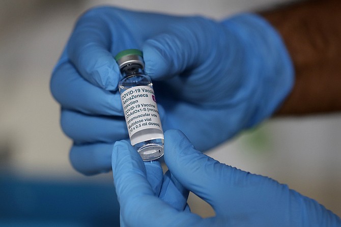 A bottle of the AstraZeneca vaccine is displayed in London. (AP Photo/Kirsty Wigglesworth)
