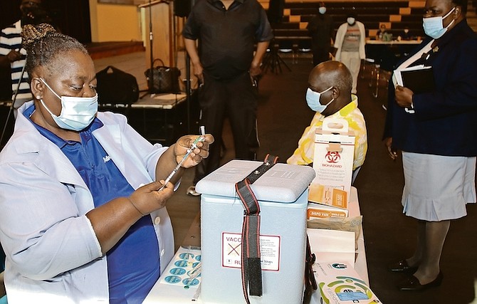 PLP Leader Philip “Brave” Davis receiving the vaccine on Saturday.