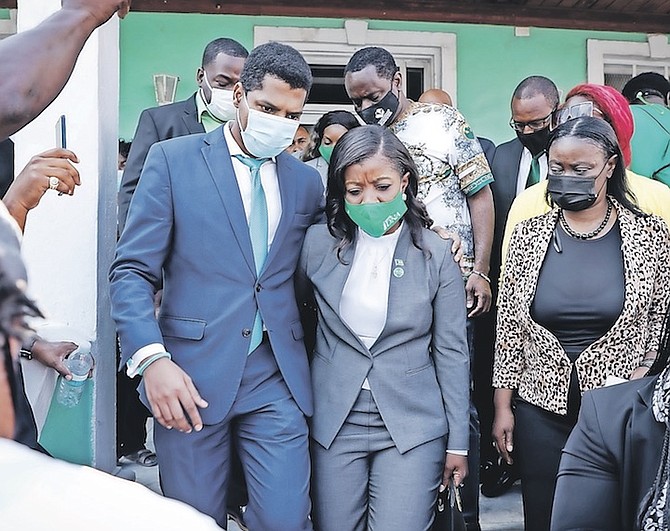 EMMANUEL and Arinthia Komolafe exiting the police station. Photo: Racardo Thomas