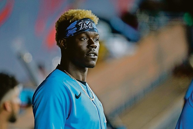 Miami Marlins second baseman Jazz Chisholm looks out from the dugout during a spring training baseball game against the Houston Astros on March 26 in West Palm Beach, Florida.

(AP Photos/Lynne Sladky)