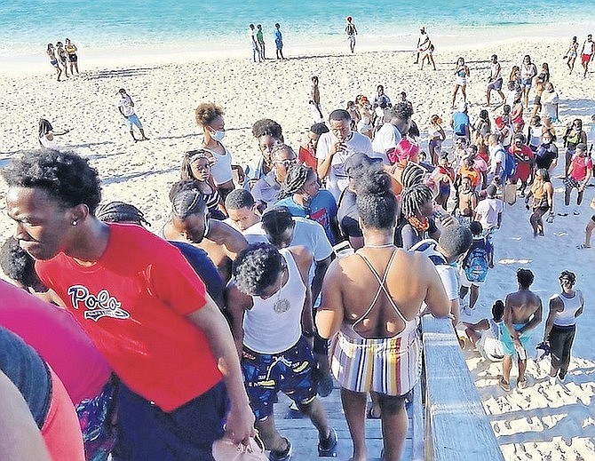 Scores of people packed at Cabbage Beach on Paradise Island on Sunday.