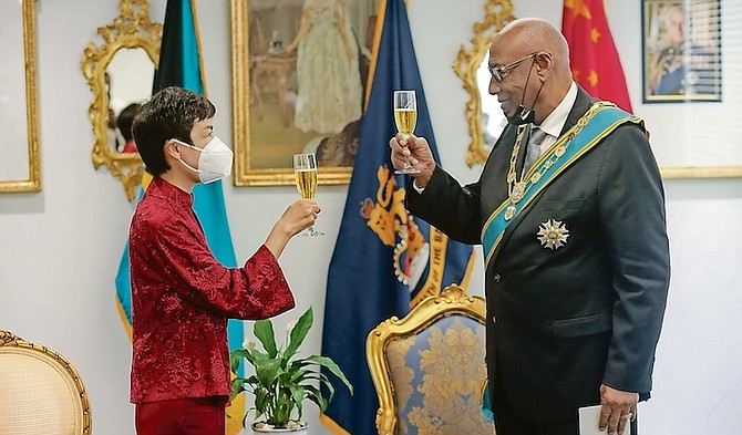 Ambassador Dai Qingli shares a toast with Governor General CA Smith.