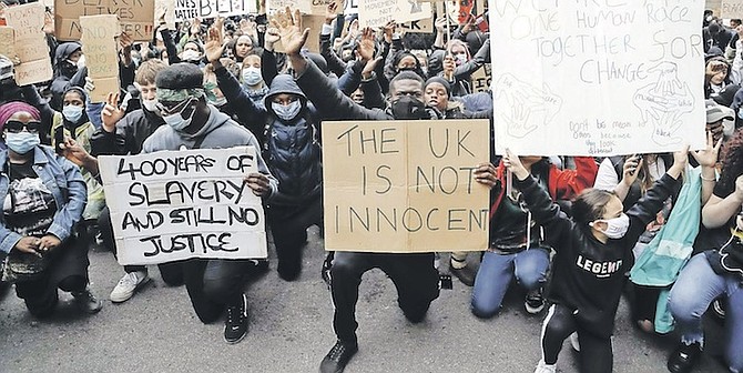 DEMONSTRATORS gather outside Downing Street during a Black Lives Matter march in London on
June 6, 2020. A government inquiry, by a panel of experts, concluded last week that there is racism
in Britain, but it’s not a systematically racist country that is “rigged” against non-white people,
though many greeted that claim with scepticism. Photo: Frank Augstein/AP