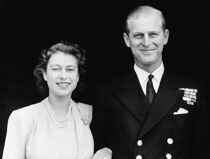 This file photo dated July 10, 1947 shows the official photograph of Britain's Princess Elizabeth and her fiance, Lieut. Philip Mountbatten in London. Buckingham Palace says Prince Philip, husband of Queen Elizabeth II, has died aged 99. (AP Photo/File)