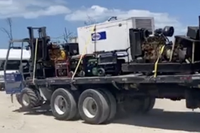 A TRUCK loaded with generators departing The Farm shanty town in Abaco yesterday in this image from video. Photo: Silbert Mills