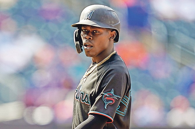 Marlins’ Jazz Chisholm Jr stands at first after being walked by Mets relief pitcher Edwin Diaz in the ninth inning on Saturday in New York.

(AP Photo/John Minchillo)