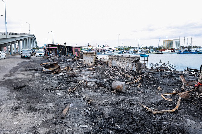 The scene at Potter’s Cay Dock on Monday after Sunday night’s blaze. Photo: Racardo Thomas