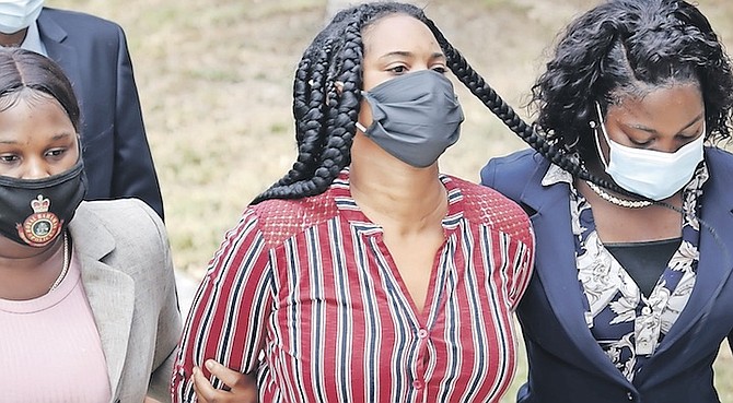 LADERIA Russell outside court yesterday. She denied a number of charges - and is accused of 160 charges in total relating to forged documents in connection with people attempting to travel using
fake COVID-19 test results. Photo: Racardo Thomas