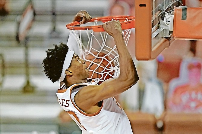 Texas forward Kai Jones dunks the ball during the first half of an NCAA college game against Kansas on February 23 in Austin, Texas. Jones has signed with Klutch Sports Group ahead of the NBA Draft.

(AP Photo/Eric Gay)