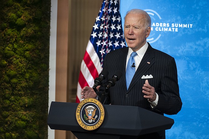 President Joe Biden speaks to the virtual Leaders Summit on Climate on Friday. Photo: Evan Vucci/AP
