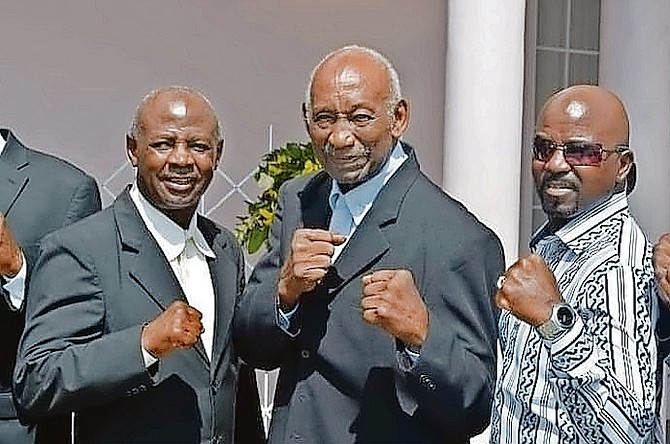Ray Minus Jr, Ray Minus Sr and Quincy ‘Thrill-A-Minute’ Pratt, pictured left to right, pose together at the funeral of Elisha Obed.