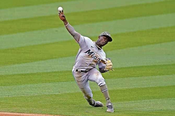 Miami Marlins shortstop Jazz Chisholm Jr (2) throws to first during the 9th inning yesterday in Los Angeles. Dodgers’ Austin Barnes singled. 
 (AP Photo/Ashley Landis)