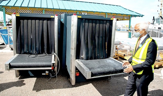 Dionisio D’Aguilar, minister of tourism and aviation, inspects luggage scanning equipment at the Nassau Cruise Port.