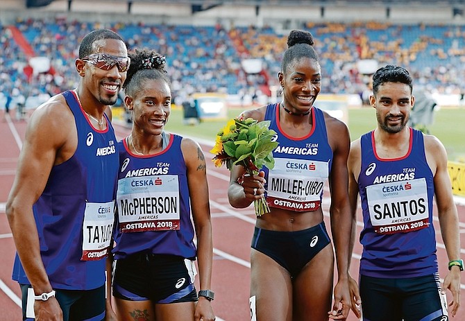 Christian Taylor, of the US, Stephanie Ann McPherson of Jamaica, Shaunae Miller-Uibo of the Bahamas, and Luguelin Santos of the Dominican Republic, pose after winning the mixed 4x400 relay for the Americas at the IAAF Continental Cup in Ostrava, Czech Republic, September 9, 2018. (AP)