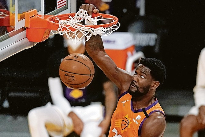 Phoenix Suns centre Deandre Ayton dunks during the first half in Game 4 of their first-round playoff series against the Los Angeles Lakers yesterday in Los Angeles.

(AP Photo/Mark J Terrill)