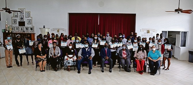 MINISTER of Youth, Sports, and Culture Iram Lewis with participants in the job readiness scheme in Grand Bahama.