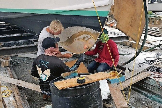 REPAIRS under way on the vessel yesterday.