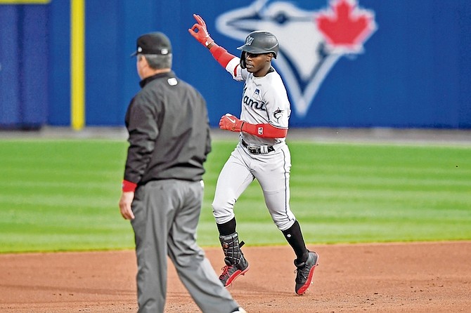 Miami Marlins shortstop Jasrado “Jazz” Chisholm Jr (2) gestures as he runs the bases after hitting a two-run home run against the Toronto Blue Jays during the third inning last night in Buffalo, N.Y.

(AP Photo/Adrian Kraus)