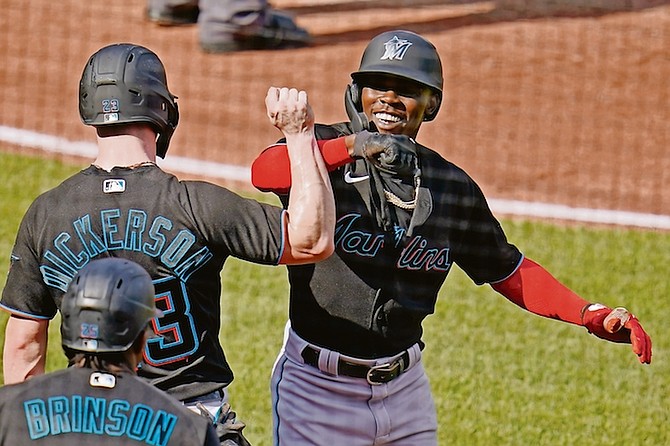 Miami Marlins’ Jazz Chisholm Jr, right, celebrates with Corey Dickerson after they scored on a two-run home run by Chisholm Jr off Pittsburgh Pirates starting pitcher Chase De Jong during the fourth inning in Pittsburgh on Saturday.

(AP Photo/Gene J Puskar)