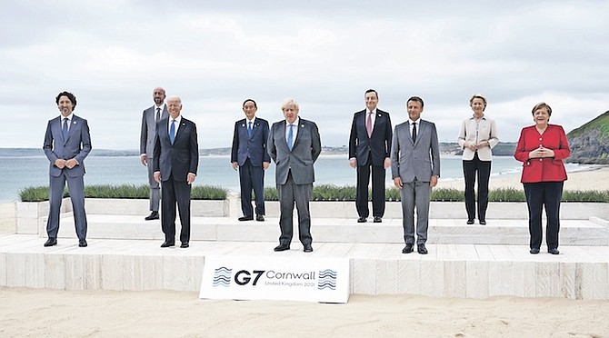 LEADERS of the G7 pose for a group photo at the Carbis Bay Hotel in Carbis Bay, St Ives, Cornwall, England, on Friday. From left, Canadian Prime Minister Justin Trudeau, European Council President
Charles Michel, US President Joe Biden, Japan’s Prime Minister Yoshihide Suga, British Prime Minister Boris Johnson, Italy’s Prime Minister Mario Draghi, French President Emmanuel Macron, European
Commission President Ursula von der Leyen and German Chancellor Angela Merkel. Photo: Patrick Semansky/AP